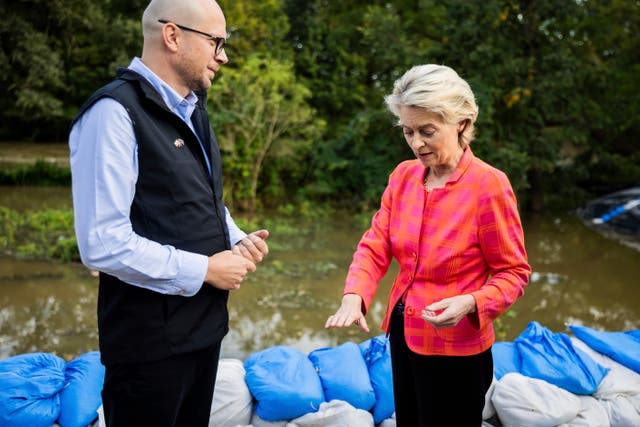 Ursula von der Leyen talks to Jakub Mazur, First Deputy Mayor of Wroclaw, next to the river Bystrzyca near Woclaw, Poland